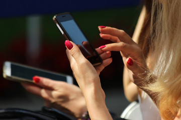Mobile phones in female hands