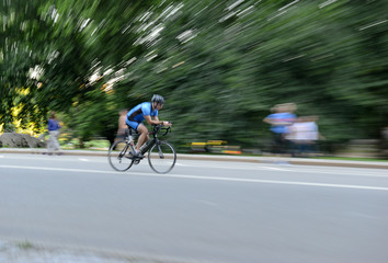 Fototapeta na wymiar Blurred motion of Cyclists riding on bicycles at speed