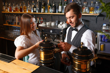 Bartender and a waitress in the bar