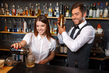 Bartender and a waitress in the bar