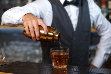 Bartender mixing drinks