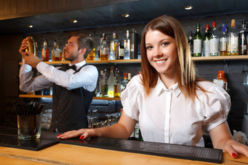 Bartender and a waitress during work