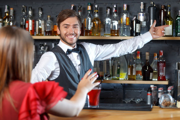 Bartender talking to visitor