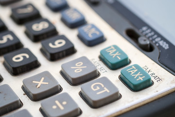 Tax button on claculator, shallow deep of field