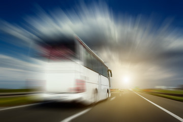 White bus in motion blur overtaking on the highway - obrazy, fototapety, plakaty