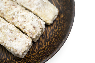 Chinese and Thai dessert of sweet taro fried on palm wood dish