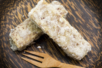 Chinese and Thai dessert of sweet taro fried on palm wood dish