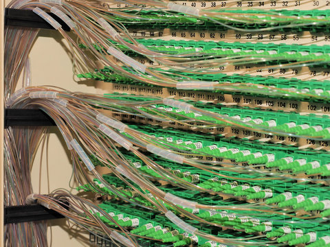 Fiber Optic Connectors and fiber routing in the back of a 576f Distribution Hub Panel connecting homes to Broad Band Services in an fiber to the Home Network