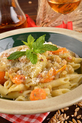 Penne rigate with carrots and cereals
