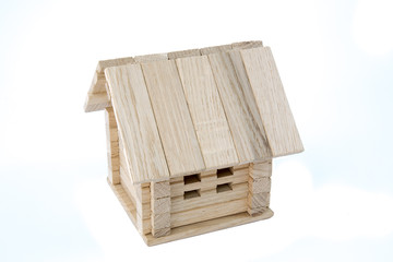 Wooden house model isolated on white background