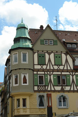 House with a green sun blind