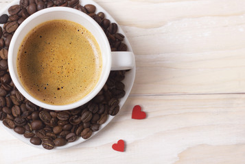 white cup of coffee with red hearts decoration