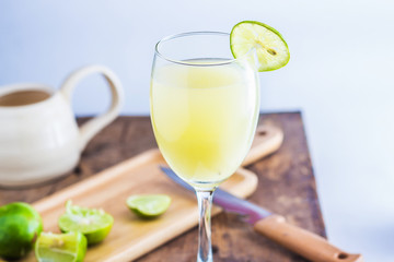 Lime Juice on wooden background