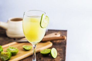 Lime Juice on wooden background