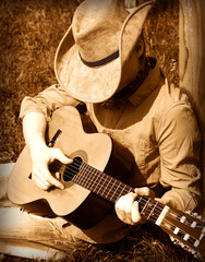 Cowboy plays guitar