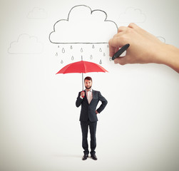 man in formal wear holding umbrella