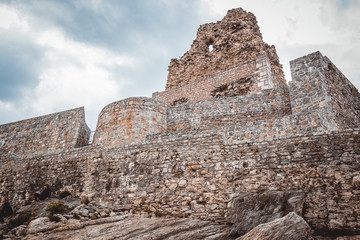 Severely damaged fortifications on the mountain top.