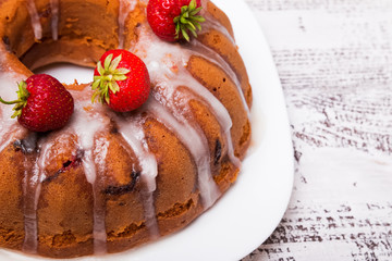 Delicious homemade cake with strawberry and glaze close-up