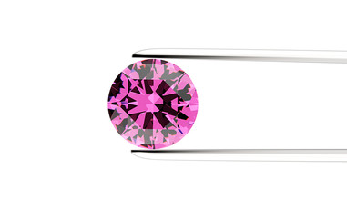 Round shape gemstone  in the tweezers. Jewelry background