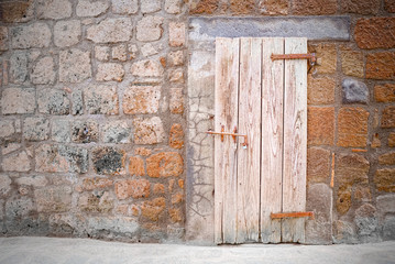 Old door of cellar in the old style of medieval village