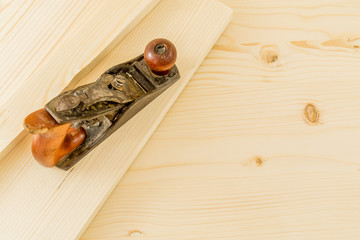 Jointer on a fresh wooden board background with excesive space