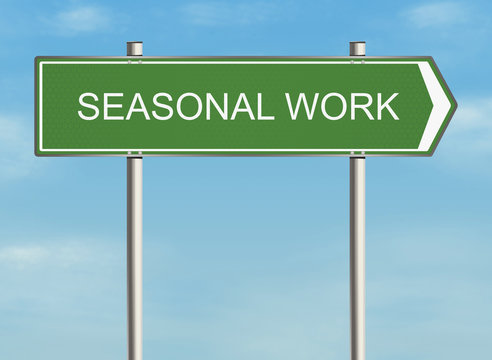 Seasonal work. Road sign on the sky background. 