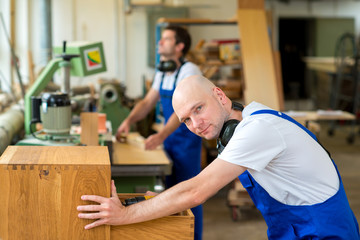 Obraz premium two worker in a carpenter's workshop