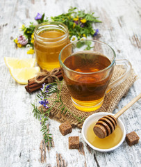 Cup of tea, honey and flowers