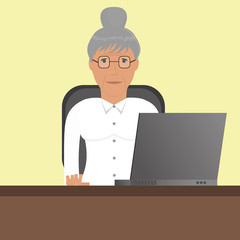 Fototapeta na wymiar Grandmother (old woman) with laptop