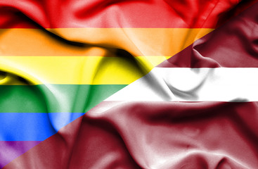 Waving flag of Latvia and Pride