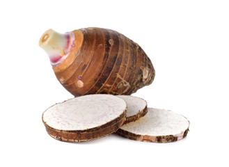 unpeeled whole and sliced taro on white background