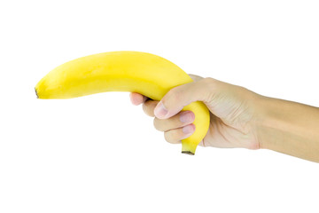 Banana in hand like a gun on white background