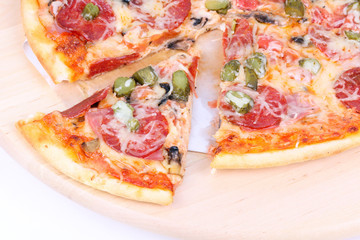 Cutted pizza on wooden board