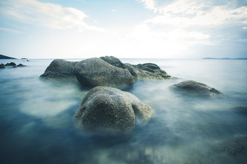 Long exposure of boulder at sea