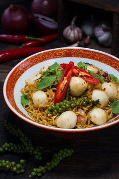 Instant noodle fried with spicy sauce and fish ball