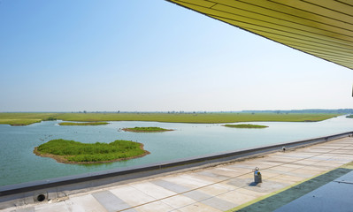 Modern bird hide along a lake in summer