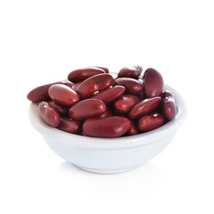 close up of a bowl of red beans on white background