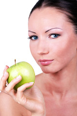 Beautiful woman with green apple in hand