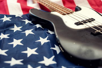 Vintage Bass guitar body on american flag background. selective focus image with shallow depth of field