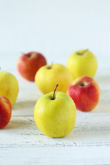 Apples on white wooden background