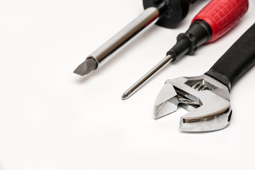 Silver Metal Monkey Wrench and screwdrivers Isolated On White Background