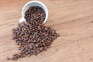 Roasted coffee beans on wood table