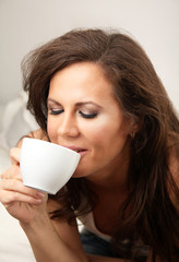 Brunette girl with cup of drink