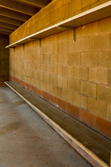 Full frame image of a concrete bullpen at a softball field in New Mexico