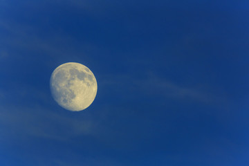 Fototapeta na wymiar Full moon in the blue sky