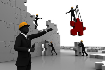 Team constructing jigsaw puzzle. A team constructing a giant jigsaw puzzle while directed by a leader.