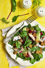 Salad with fresh organic beetroot,herrings and rye croutons.