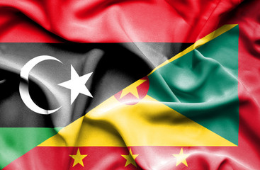 Waving flag of Guernsey and Libya