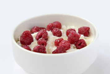 cup with cream cheese and raspberries