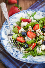 Arugula, strawberry, blueberry and blue cheese salad
